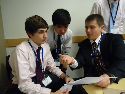 Delegates discussing a working paper in the Security Council