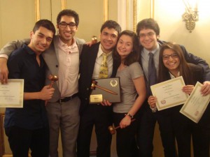 Crisis Director Chirag Sachar poses with several UChicago delegates and their awards at HNMUN's Sixtieth Session.