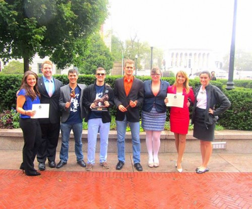 The University of Florida poses with their Best Delegation trophy and individual awards.