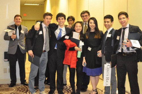 Delegates take a photo together after an exhausting day of committee sessions.