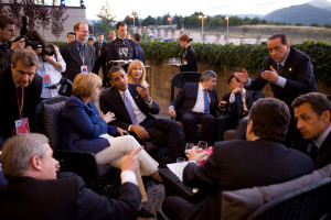 President Barack Obama confers with world leaders, Canadian Prime Minister Stephen Harper, German Chancellor Angela Merkel, British Prime Minister Gordon Brown, Japanese Prime Minister Taro Aso, Italian Prime Minister Silvio Berlusconi, and French President Nicolas Sarkozy, while attending the G-8 summit in L'Aquila, Italy, July 8, 2009. (Official White House Photo by Pete Souza) This official White House photograph is being made available for publication by news organizations and/or for personal use printing by the subject(s) of the photograph. The photograph may not be manipulated in any way or used in materials, advertisements, products, or promotions that in any way suggest approval or endorsement of the President, the First Family, or the White House.